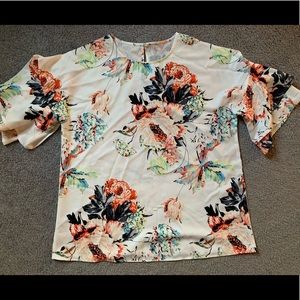Brand new, never worn really cute floral  blouse with bell sleeves.